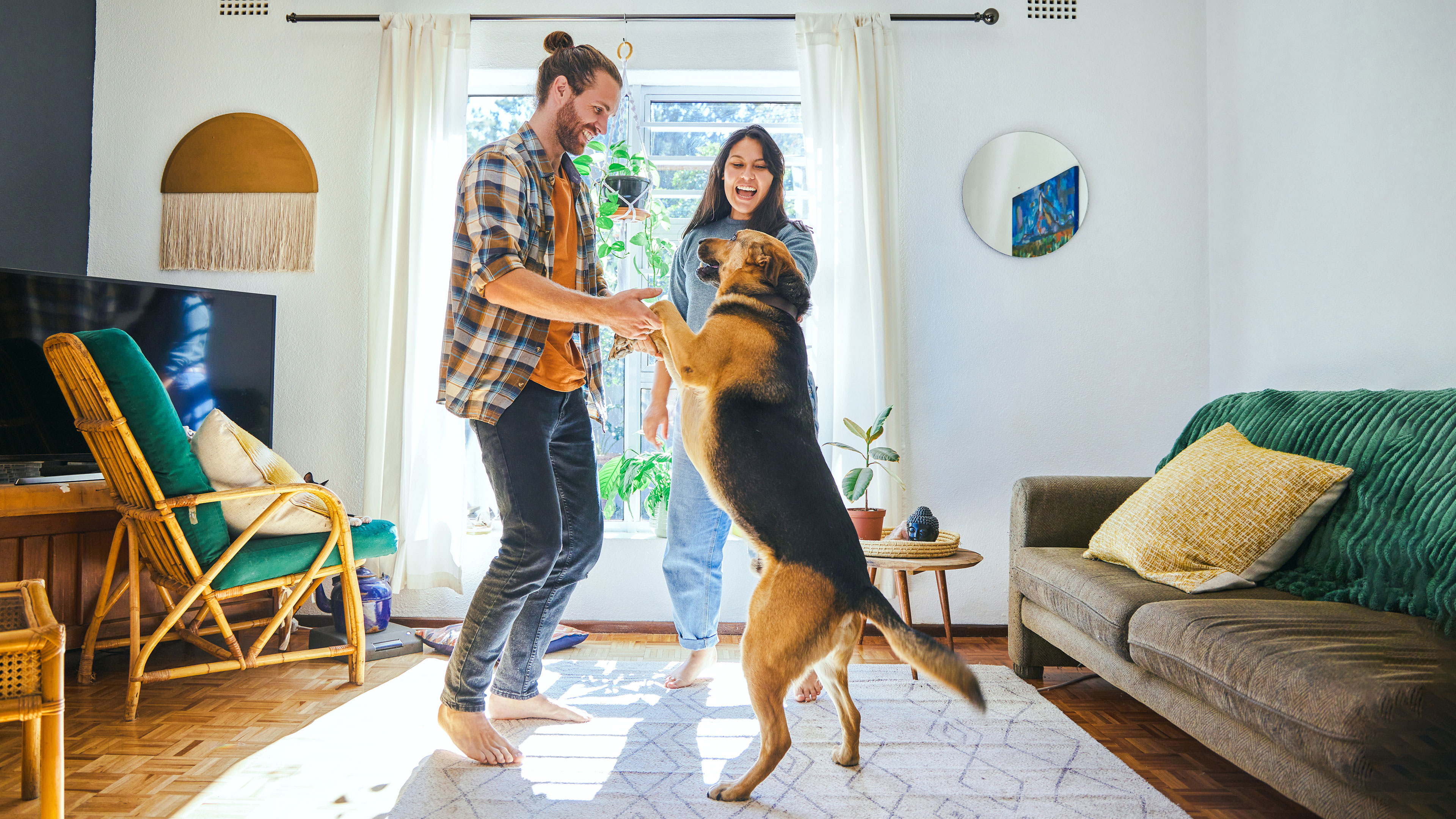 Pet owners and dog celebrating 